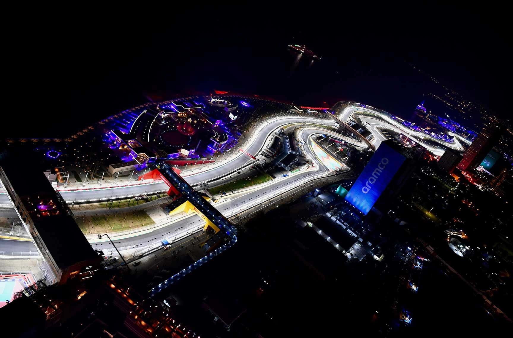 Aerial night view of the floodlit Jeddah Street Circuit weaving along the Red Sea corniche