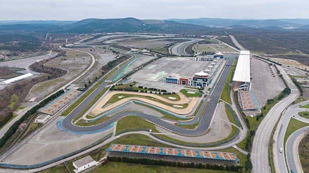 Aerial view of Istanbul Park circuit and its grandstands, with wooded hills beyond