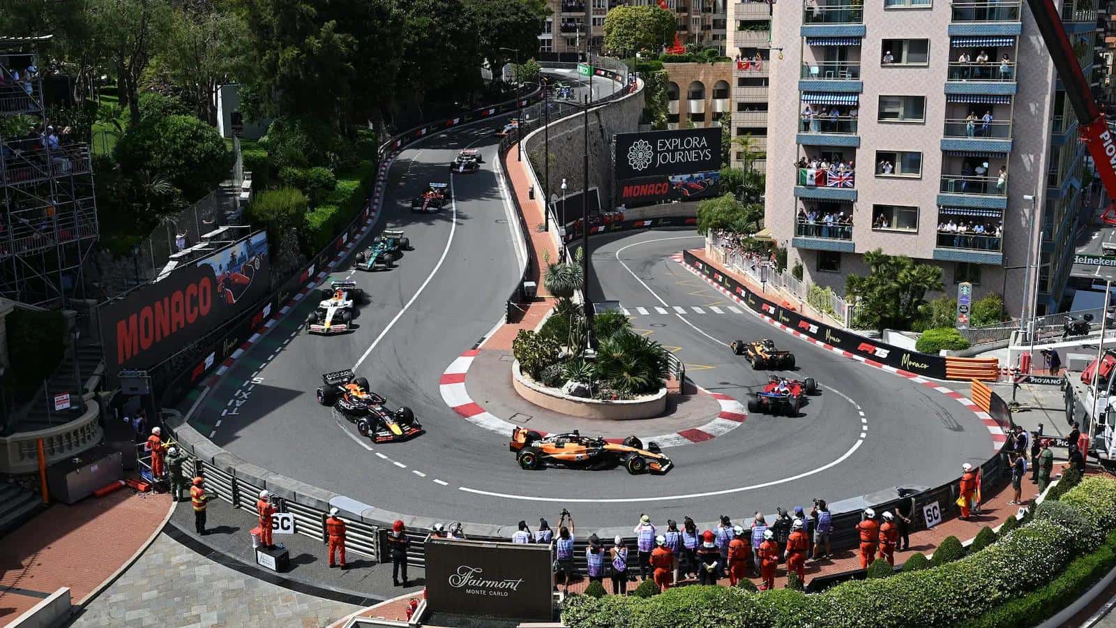 F1 cars thread through the Fairmont Hairpin in Monaco between hotels and apartment balconies